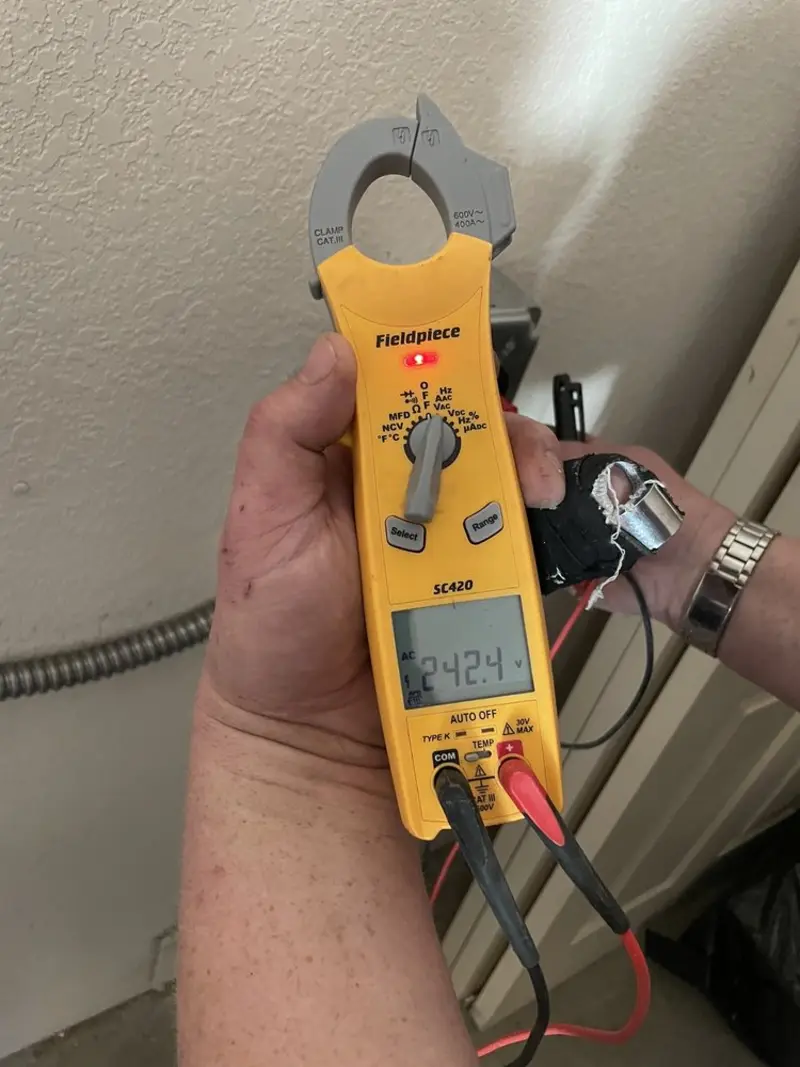 Voltage testing with clamp meter during Ceiling Fan Installation in Sikeston